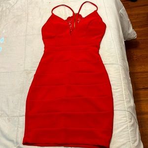 Im selling a red tight dress in the size Small.